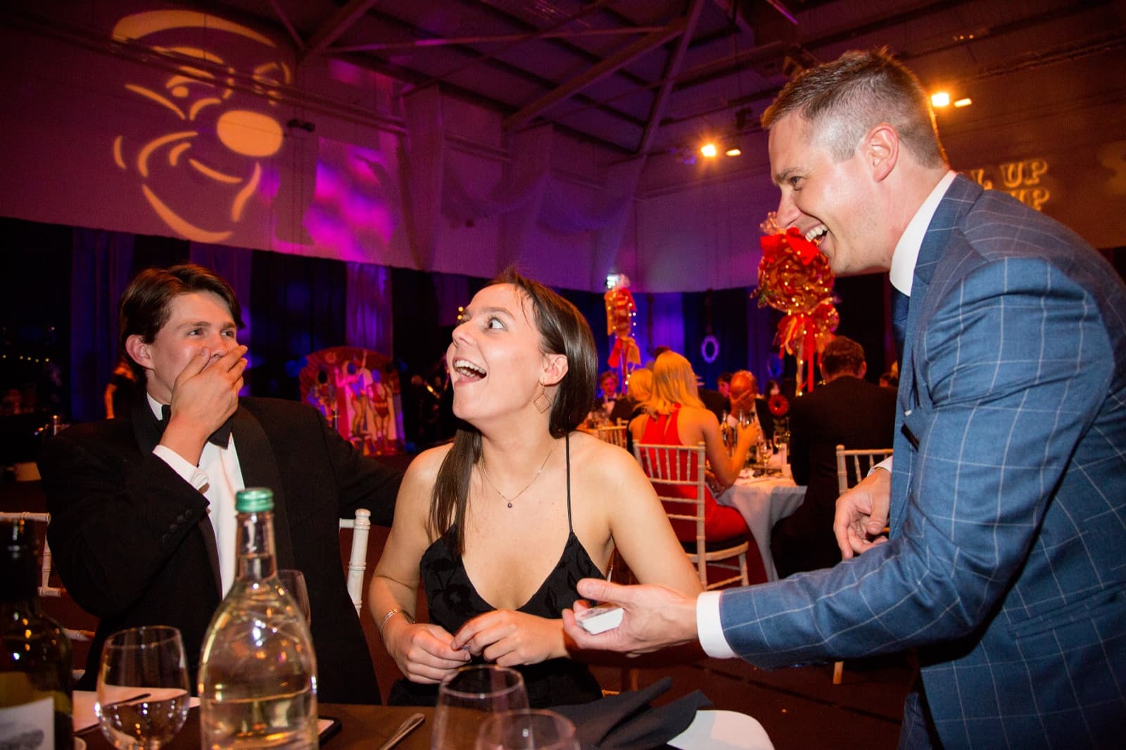 Guests reacting to close-up magic at a Sheffield event