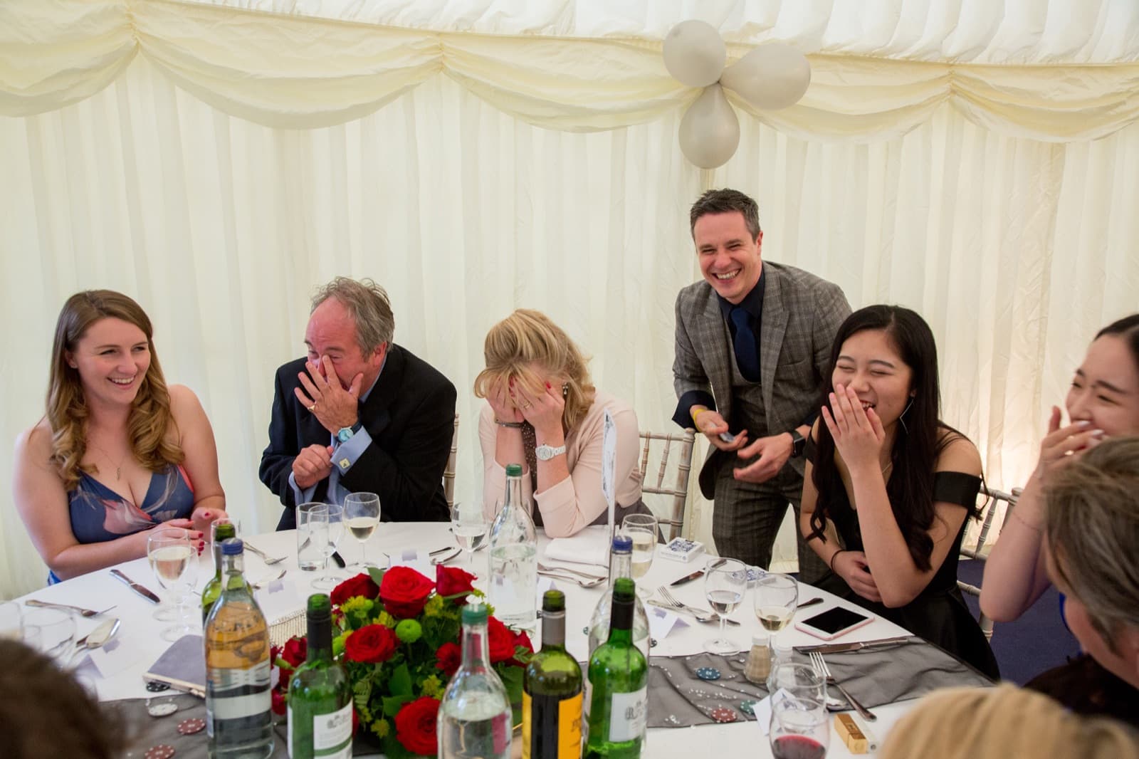 Wedding guests laughing